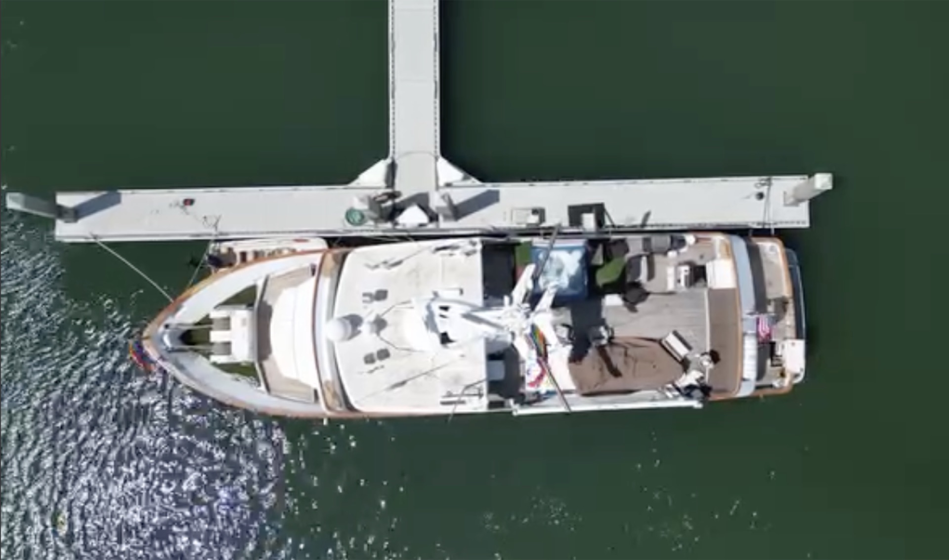 Top-down aerial of the yacht at the dock